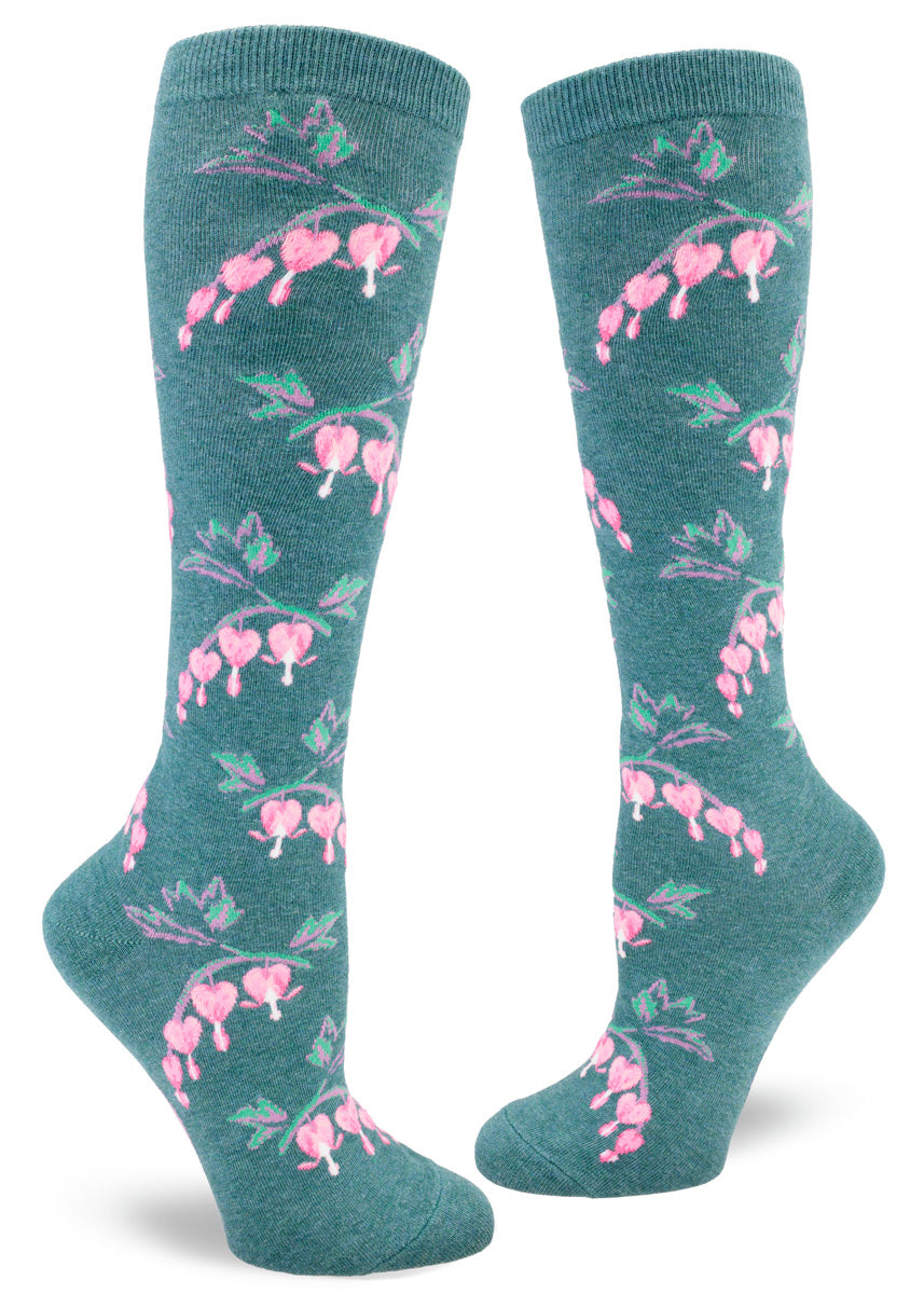 Dark teal knee socks for women with an allover pattern of pink bleeding heart flowers.