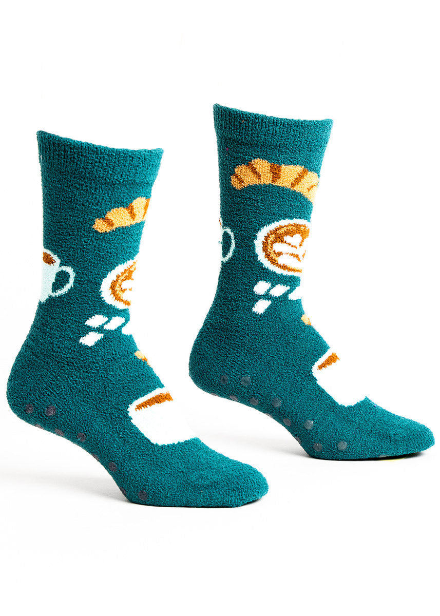 Fuzzy teal slipper crew socks for women with a pattern of croissants, lattes, and sugar cubes.