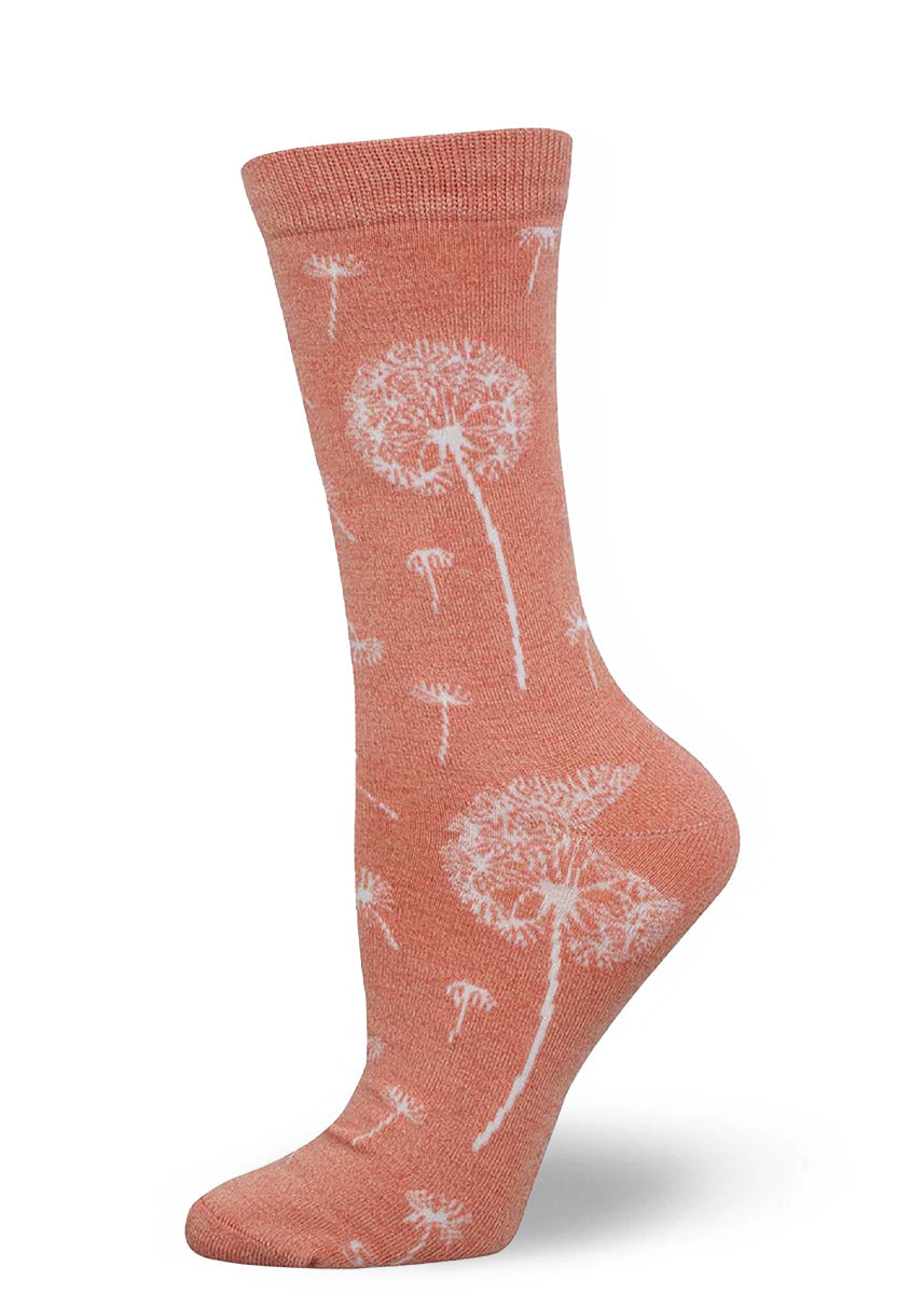 Peach crew socks for women with a delicate pattern of white dandelions.