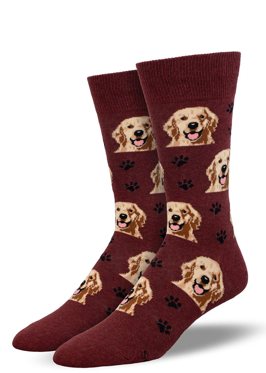 Dark red crew socks for men with an allover pattern of golden retriever faces and black paw prints.