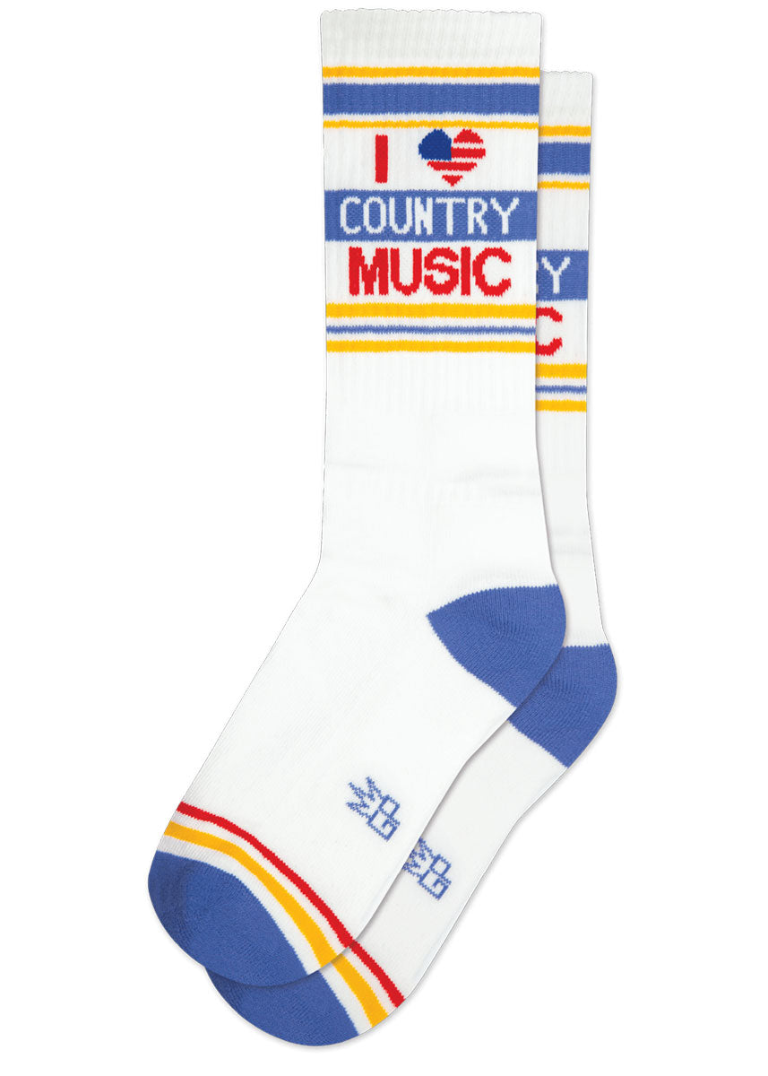 White retro gym socks with blue, red, and yellow stripes and the phrase “I ❤️ COUNTRY MUSIC&quot; where the heart looks like an American flag.
