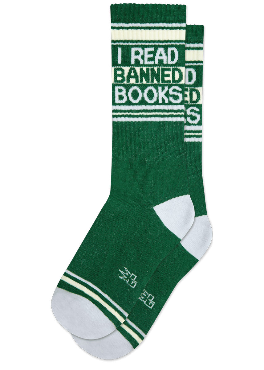 Green retro gym socks with cream and light gray stripes and the phrase "I READ BANNED BOOKS" on the leg.