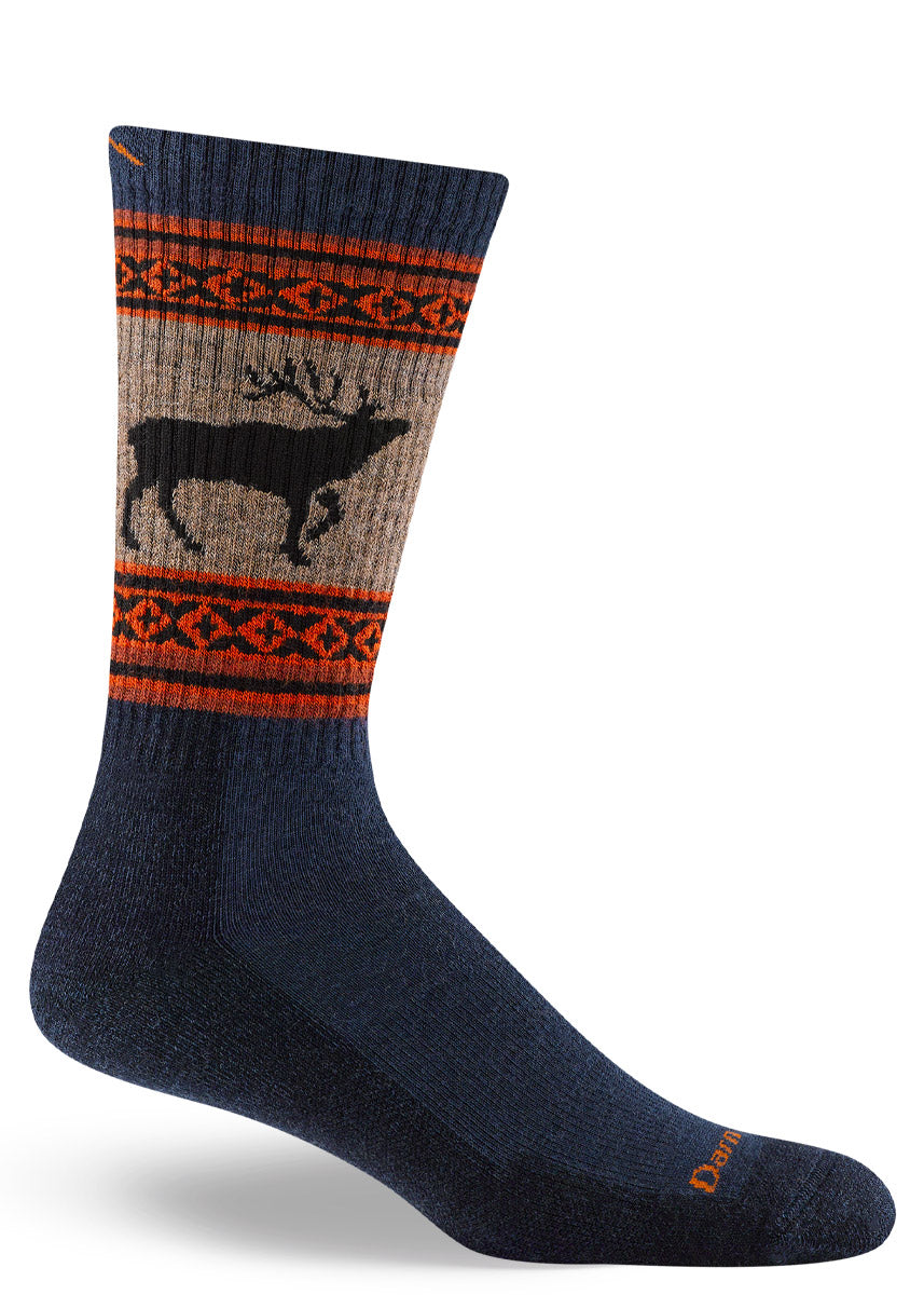 Cushioned wool hiking socks for men feature a black stag over a light brown and navy background with orange accents.