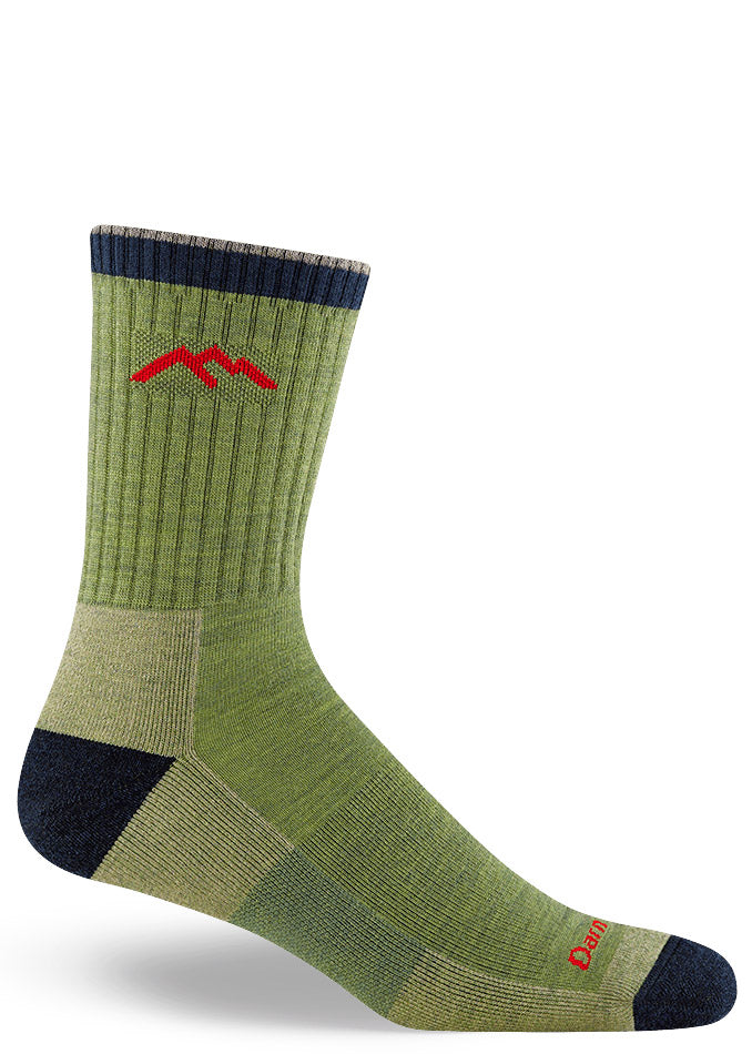 Green hiking socks for men in crew length with a black cuff, heel, and toe. 