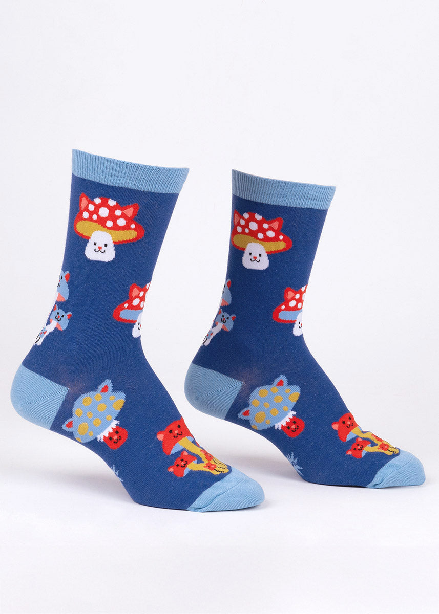 Blue crew socks for women with an allover pattern of colorful toadstool mushrooms with cat faces and cat ears.