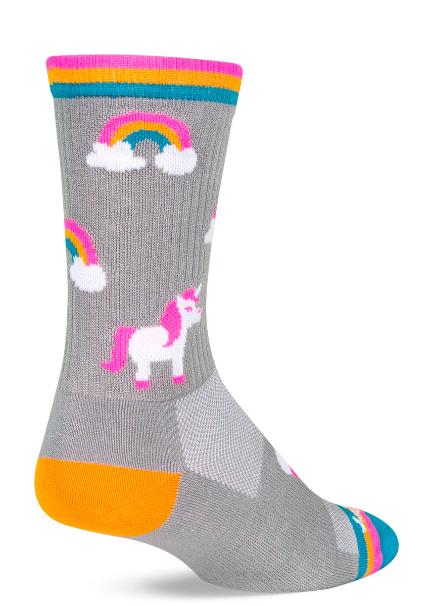 Gray athletic crew socks with an allover pattern of neon rainbows and unicorns and a rainbow striped cuff. 