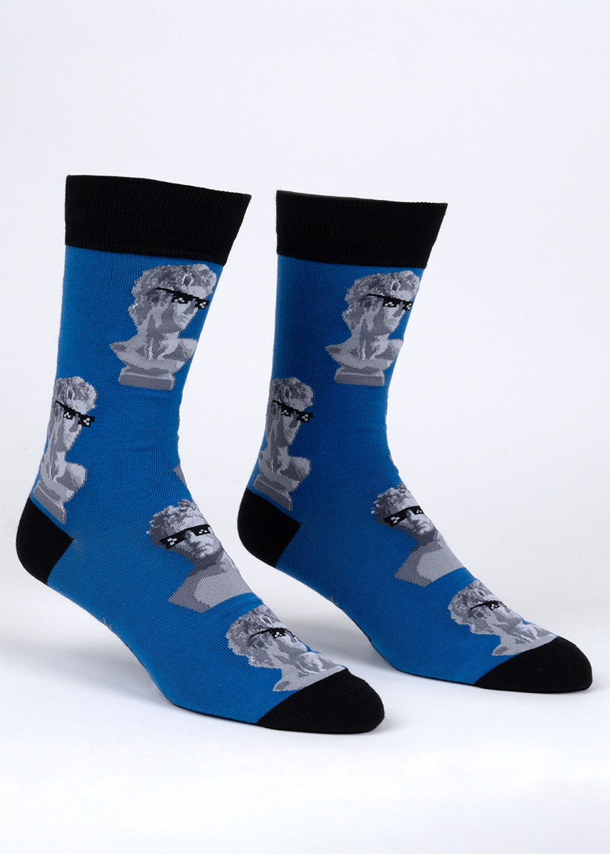 Blue novelty socks for men with an allover pattern of Roman-style busts wearing black sunglasses.