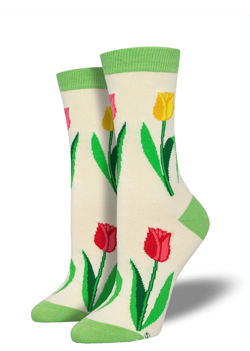 Ivory crew socks accented with green at the heel, toe and cuff, featuring a pattern of yellow and red tulip flowers.