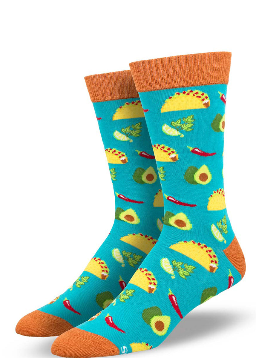 Teal bamboo crew socks for men with a bright allover pattern of tacos, avocado, chili peppers, and cilantro with lime.