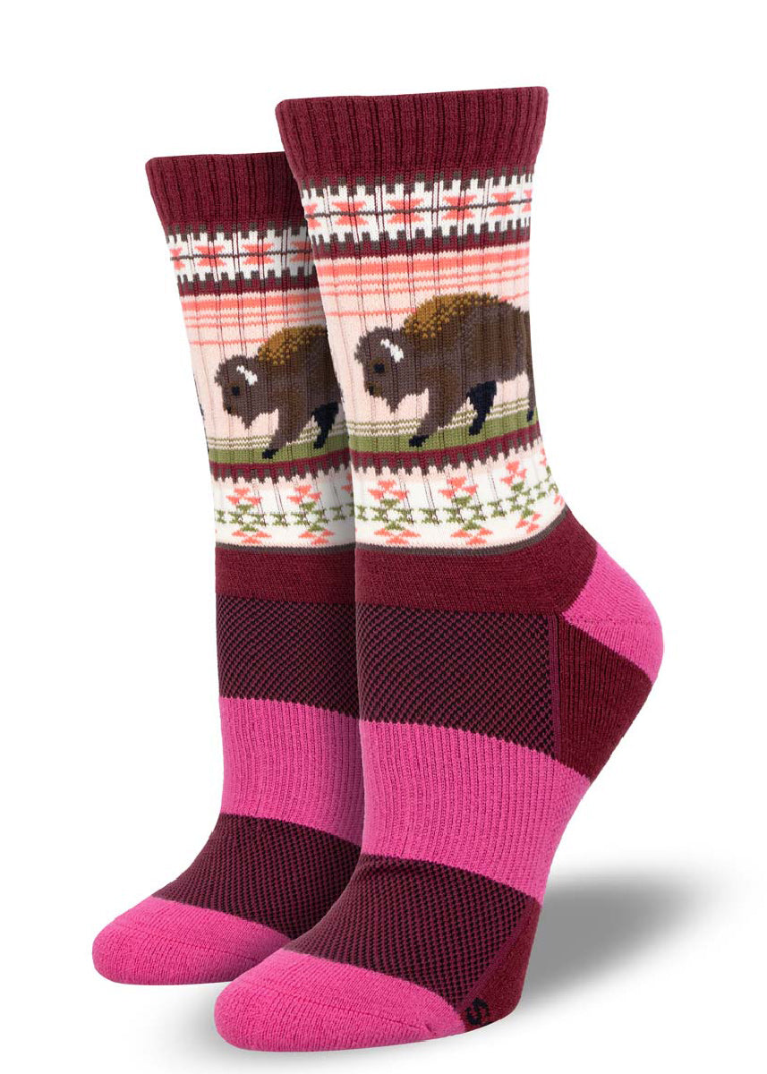 Red hiking socks for women show a brown buffalo and a pink and green southwestern-style pattern.