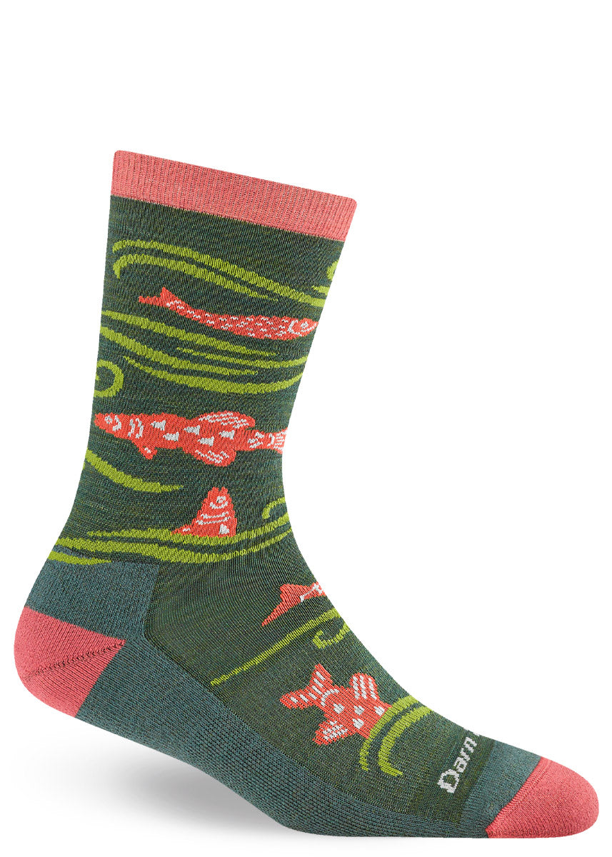 Dark green wool hiking socks for women with an allover pattern of pink salmon and light green waves. 