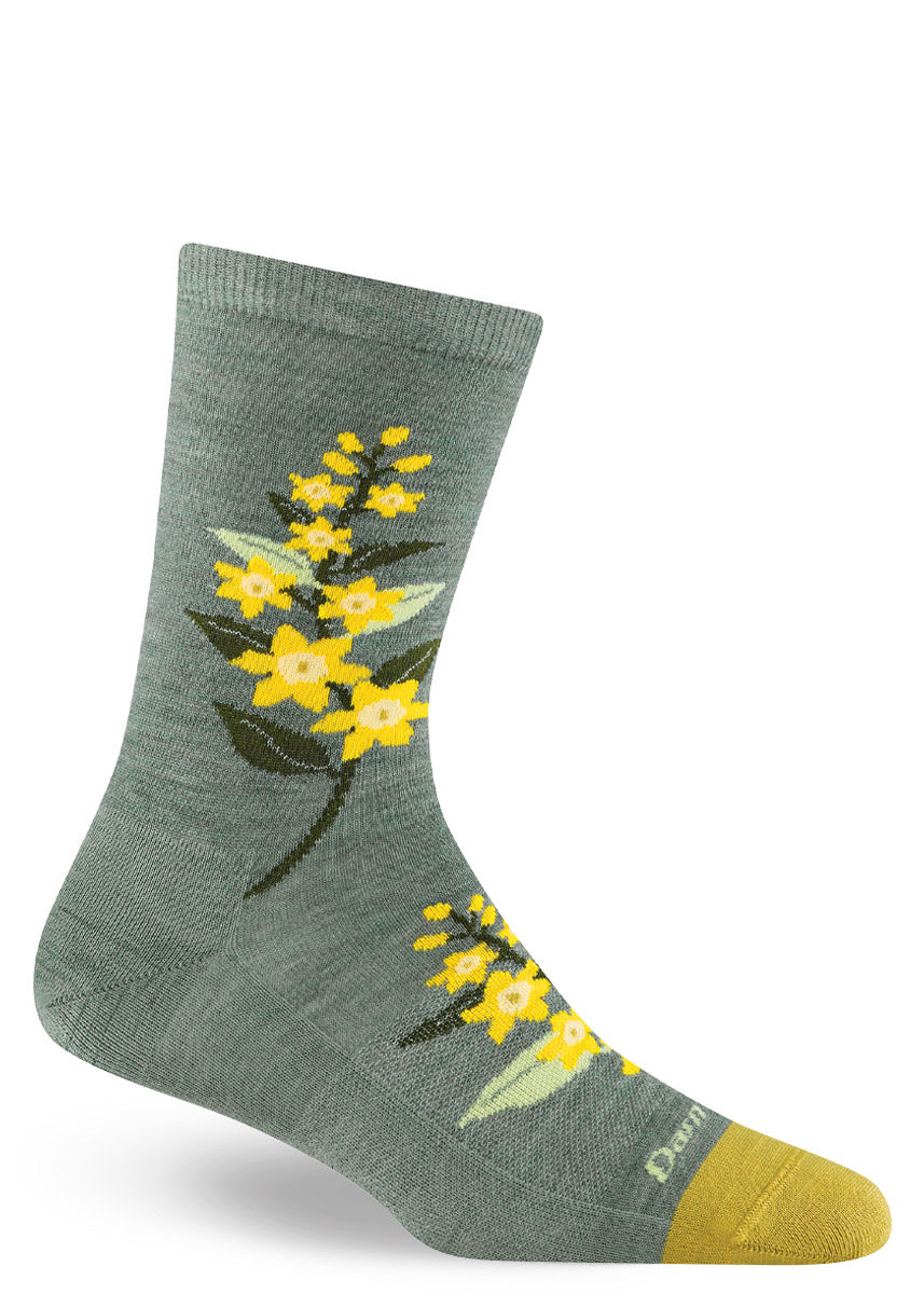 Teal wool hiking socks for women with a yellow blossom design.